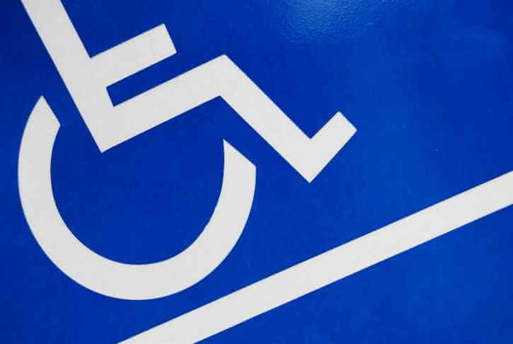 Sign showing access to wheelchair ramp
