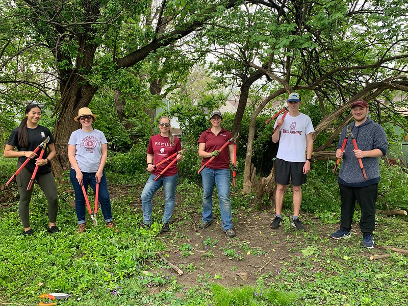 Members of the Bellarmine University community participate in the Spring in Action volunteer event at the Kentucky State University Extension in Louisville, Kentucky