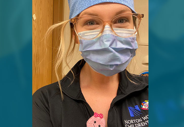 Sarah Pelke wearing a protective face mask