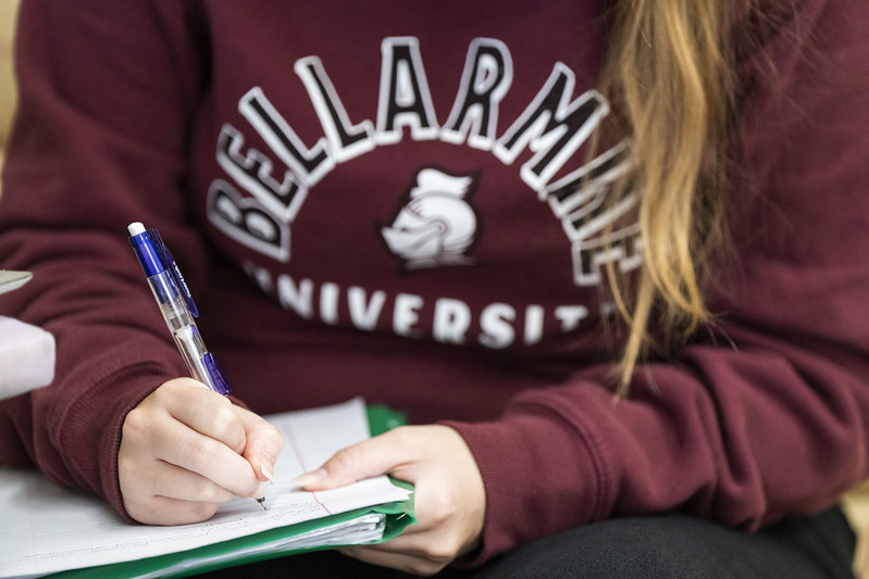 A Bellarmine University student taking notes.