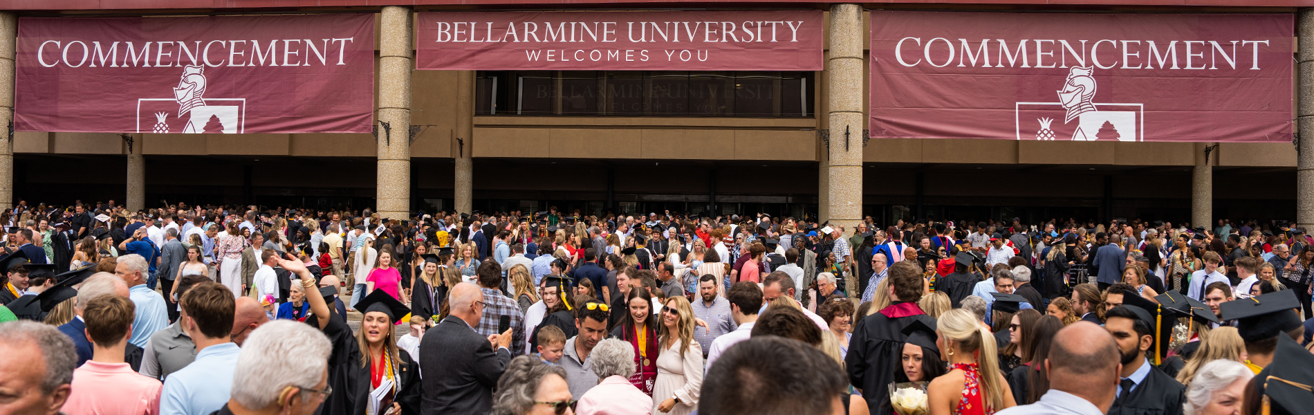 People walking into Freedom Hall at Commencement 2023