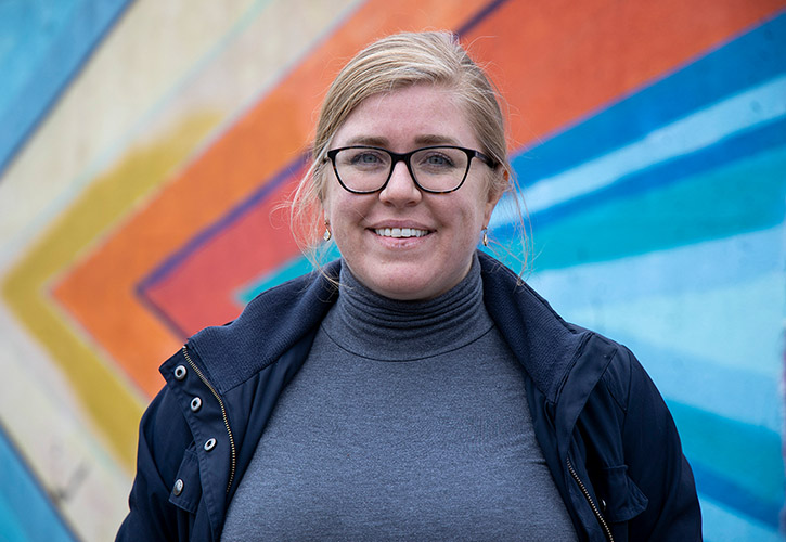 Headshot of Jennifer Chappell in front of a mural