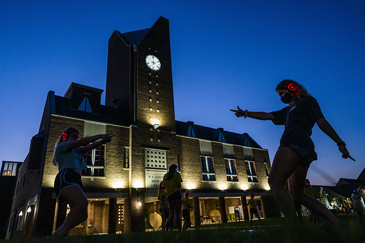 Students dancing in quad during orientation silent disco