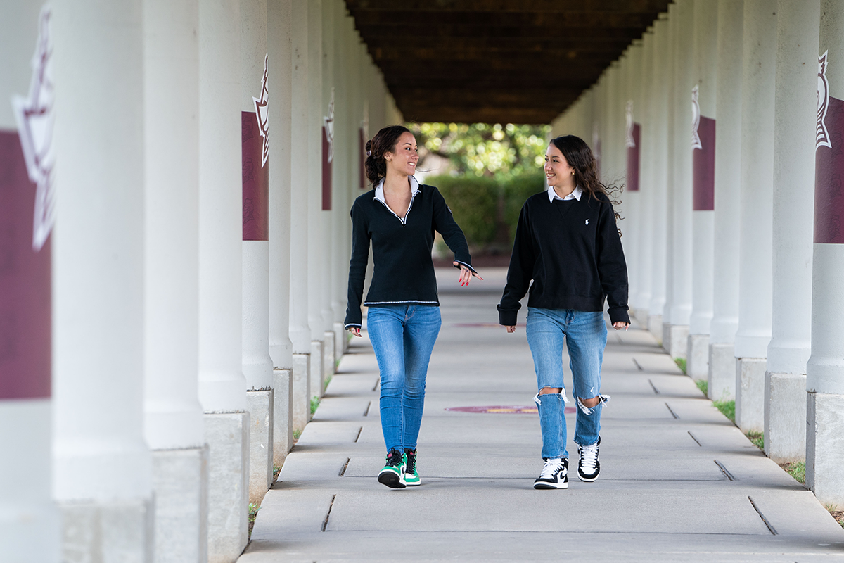 Butler twins walking through the Quad