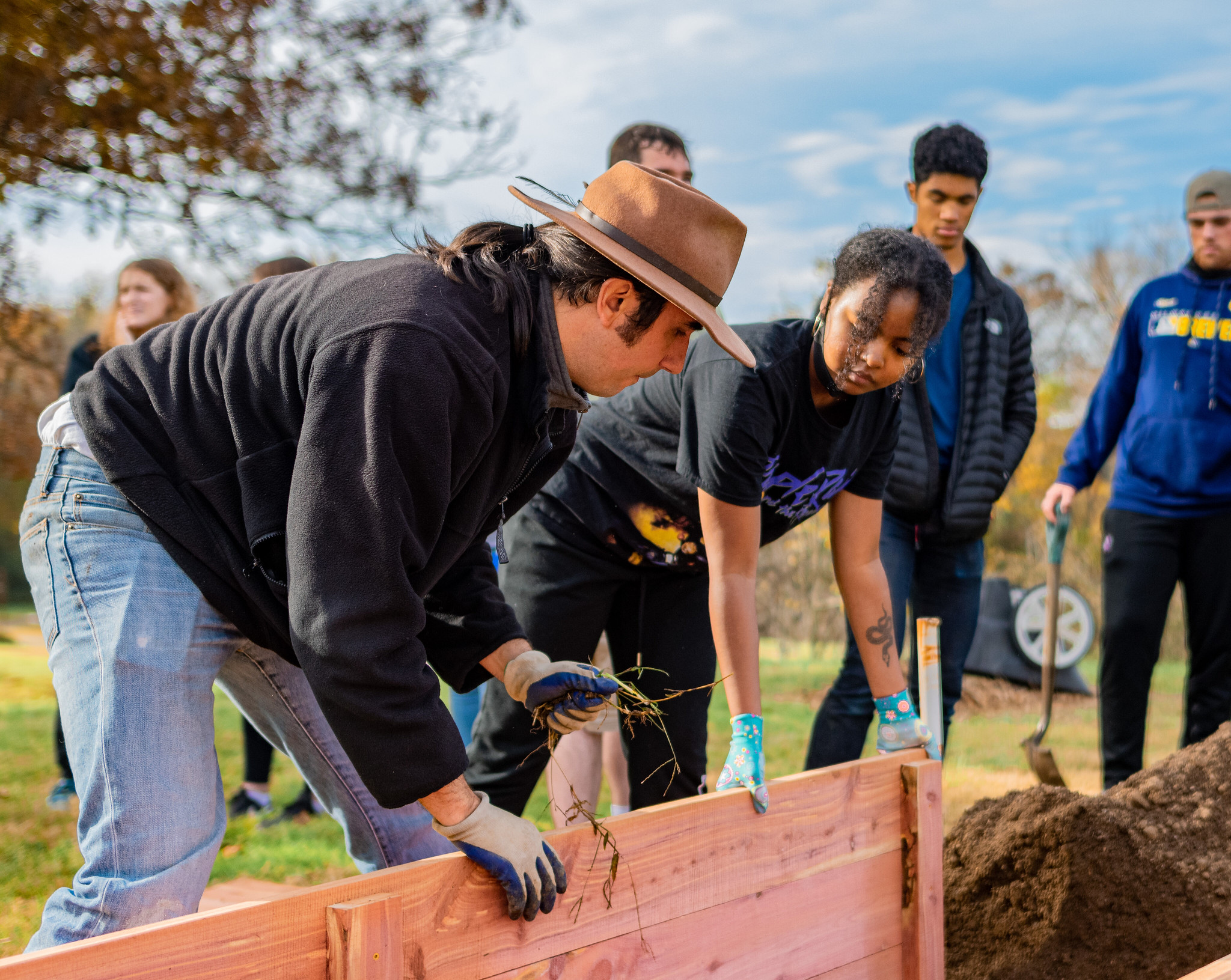 students working outside in raised garden