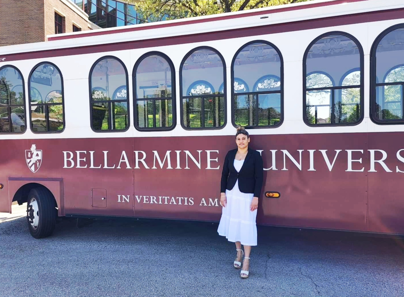 Maray Estacholi Veliz poses in front of the Bellarmine trolley