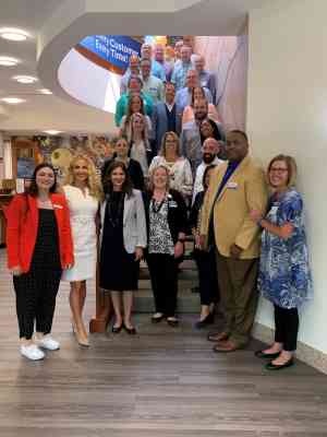 Rubel School Dean Natasha Munshi, Kroger Louisville Division President Ann Reed and the participants in the Executive Education, Emerging Leaders Certificate program .