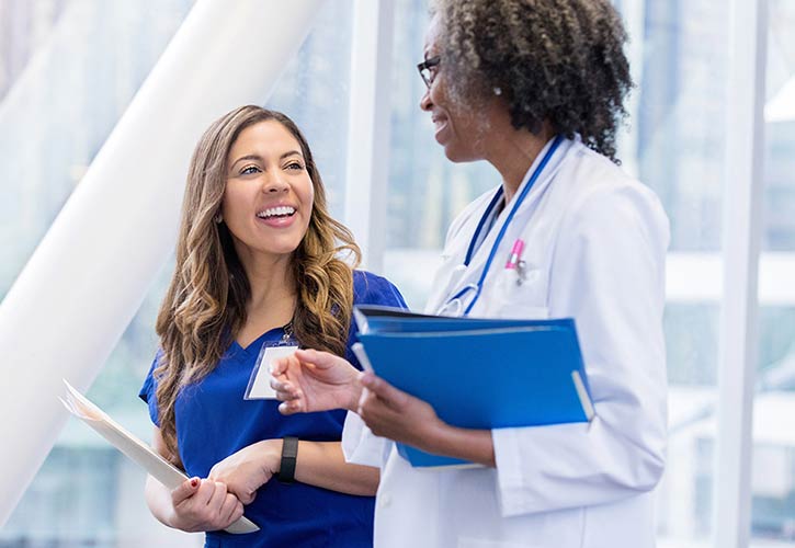 Nursing student talking to instructor