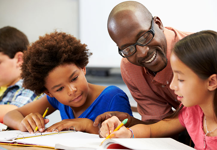 Teacher in a classroom with students.