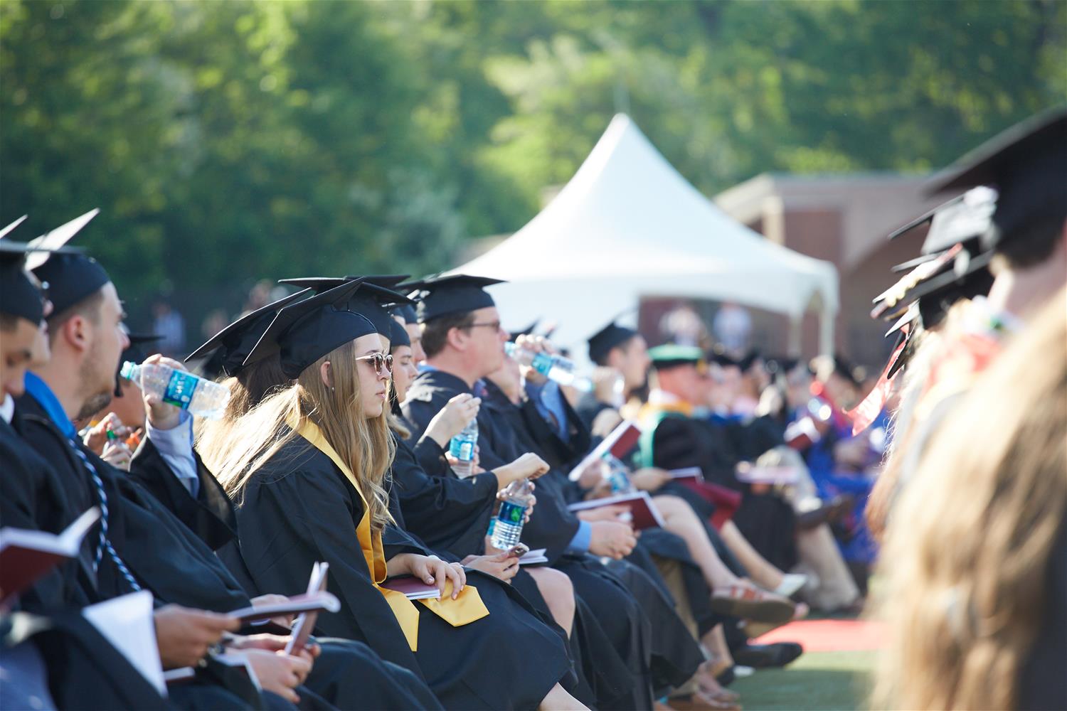 Students listening to Commencement speakers