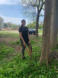 Members of the Bellarmine University community participate in the Spring in Action volunteer event at the Kentucky State University Extension