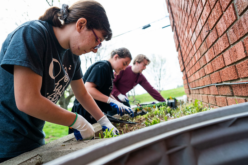 Members of the Bellarmine University community participate in the Spring in Action volunteer event at various locations in Louisville, Kentucky