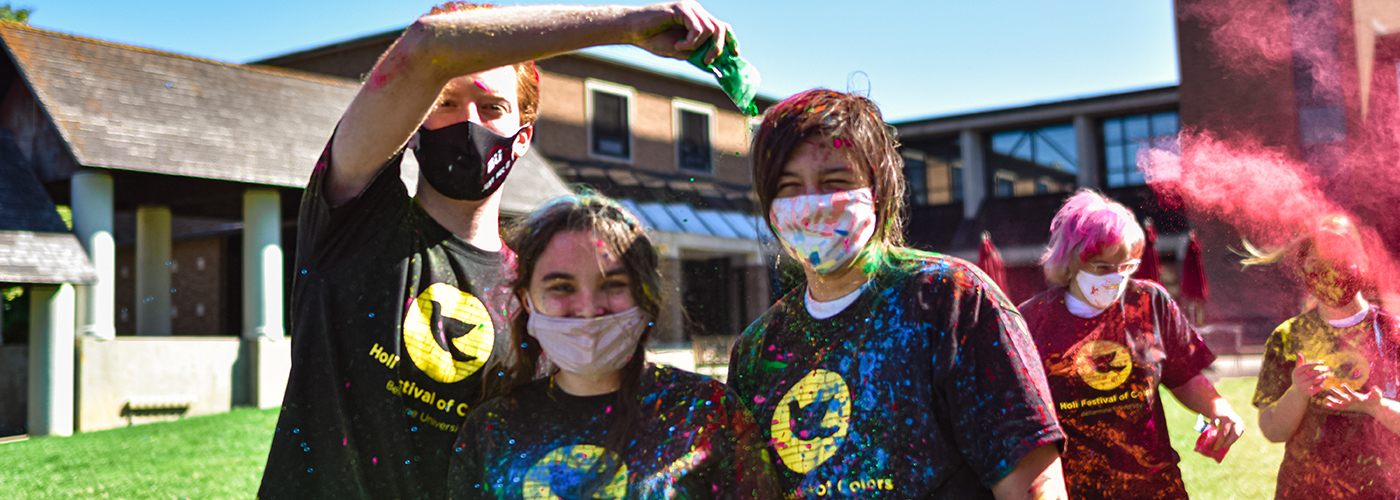 Students participating in a Holi Celebration color throw