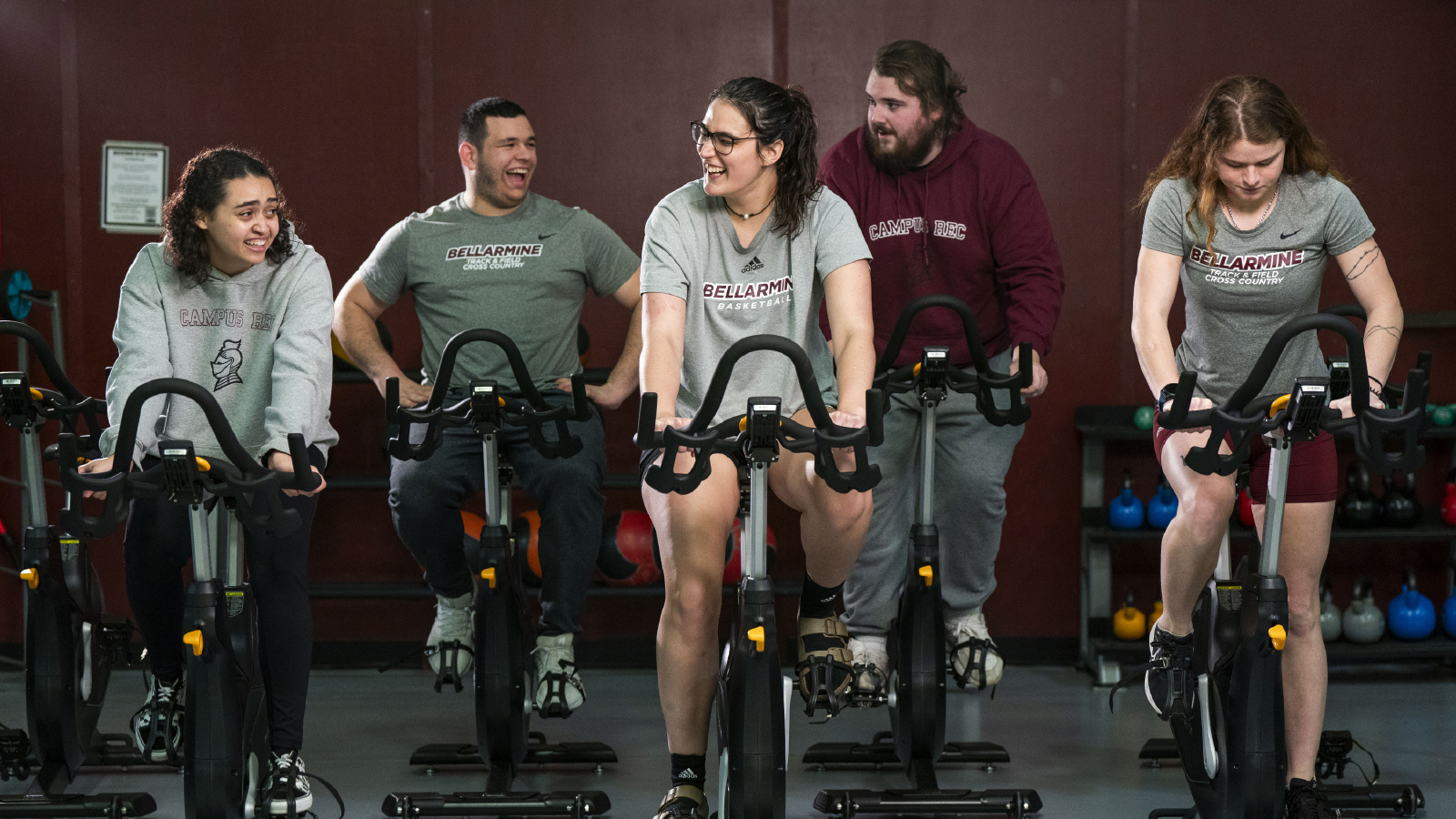 SuRF Center interior with students weight lifting