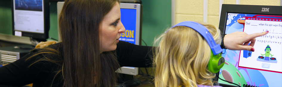 Teacher helping student