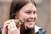 Student holding a tortoise