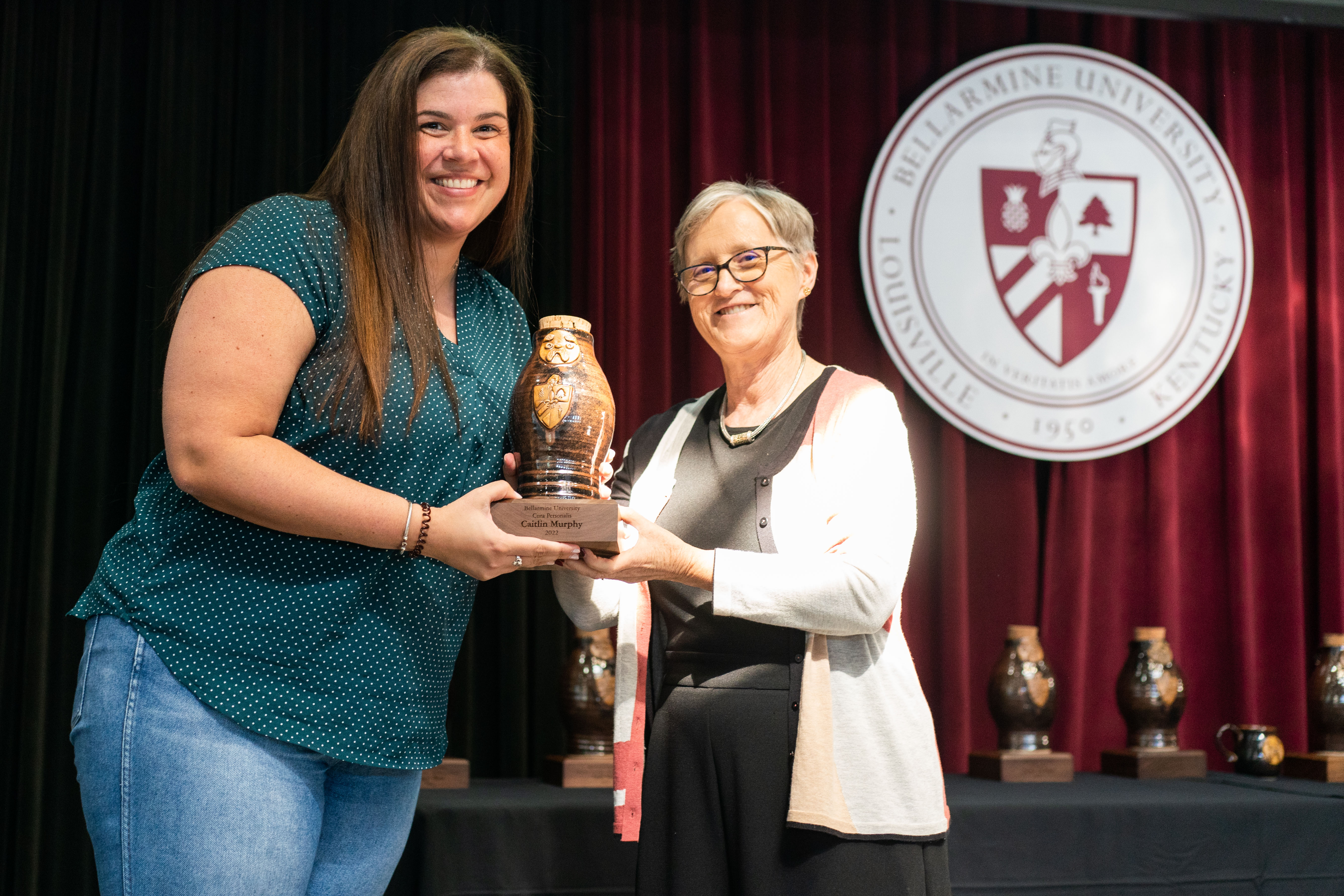 Dr. Caitlin Murphy recieves Cura Personalis award.