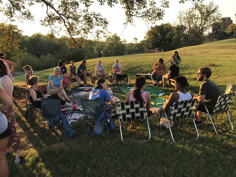 Students in lawn chairs at the Bellarmine Farm