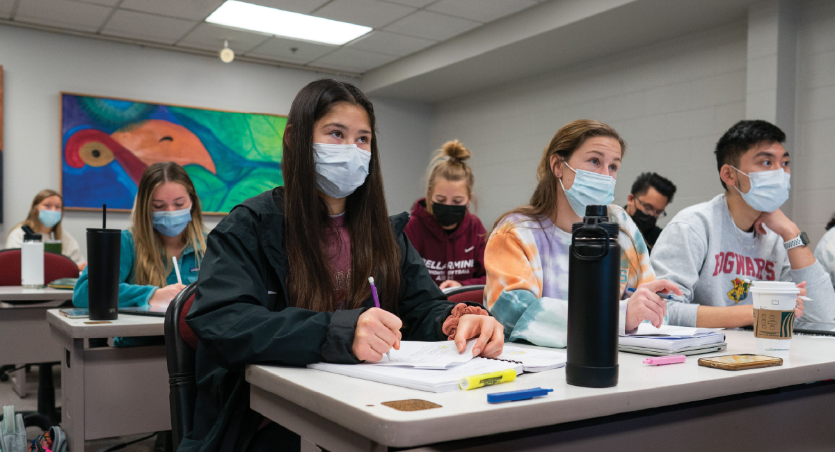 Students listen attentively and taking notes during class