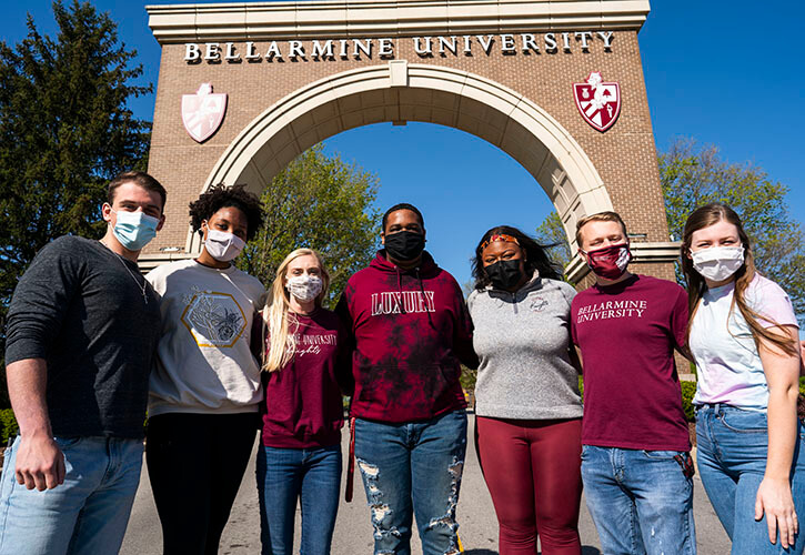 Students standing in front of St. Robert's Gate