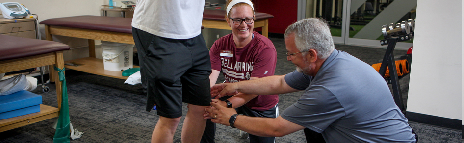 Athletic Training instructor demonstrates technique to students