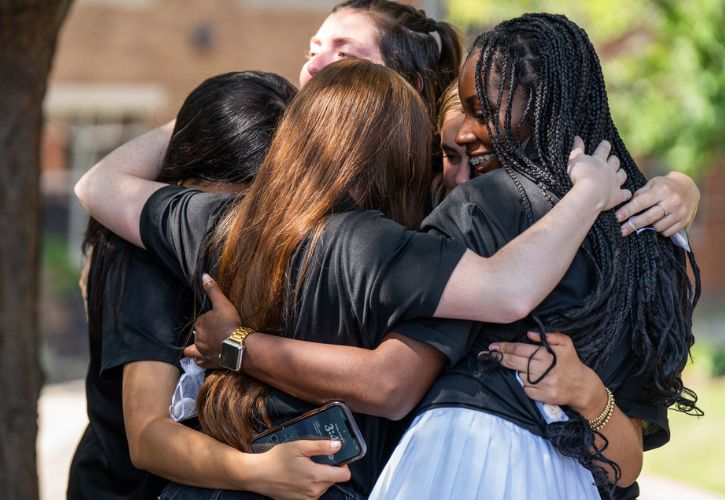 Res Life officers in a group hug