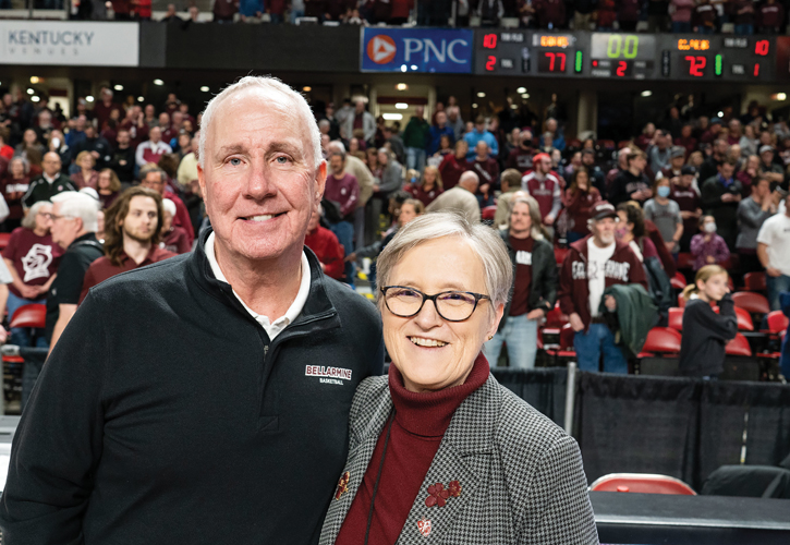Men's basketball coach Scott Davenport and President Susan M. Donovan courtside at the ASUN Championship game.