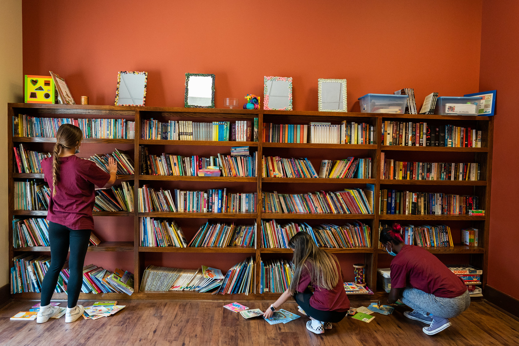 Student stack books at Family Scholar House