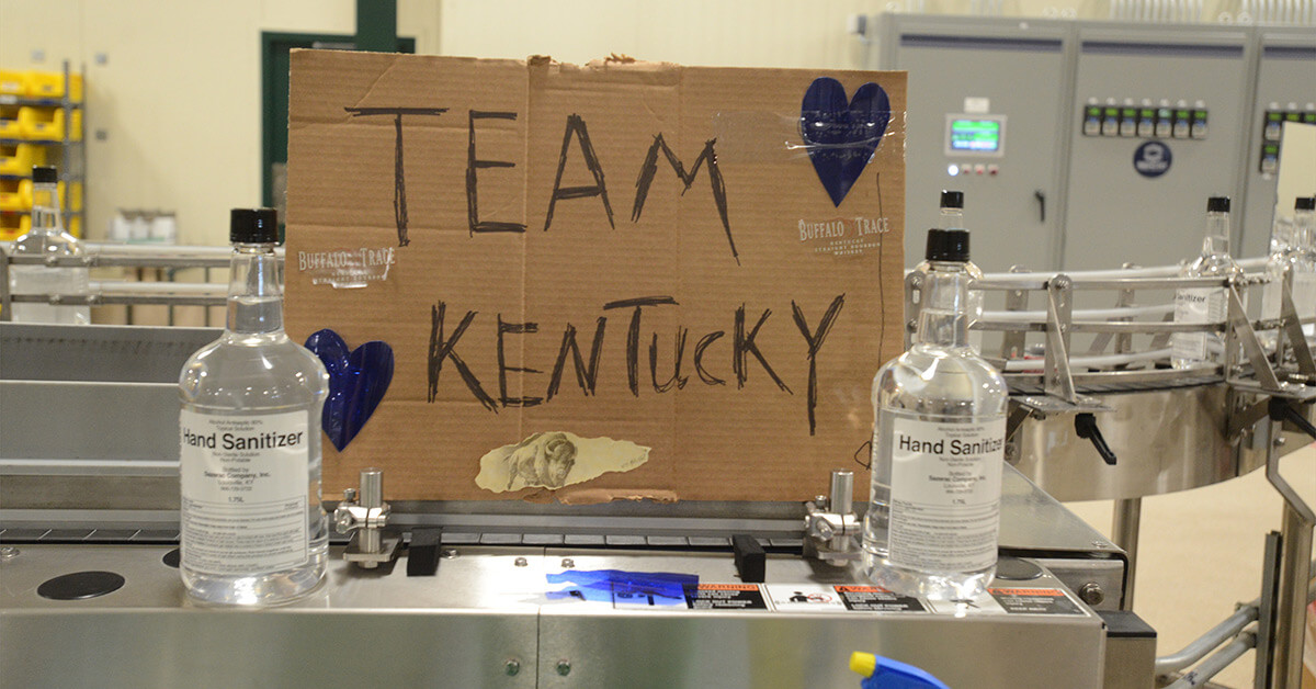 "Team Kentucky" sign at Buffalo Trace hand sanitizer production line