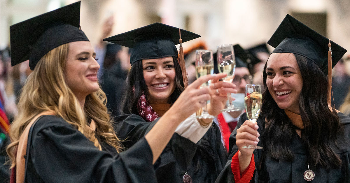 2021 Bellarmine graduates toast following commencement.