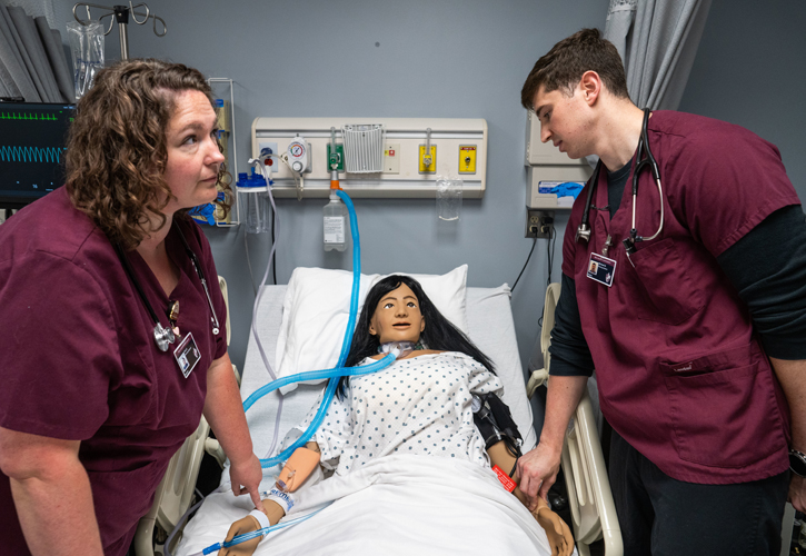 Two nursing students working in Bellarmine's simulation lab