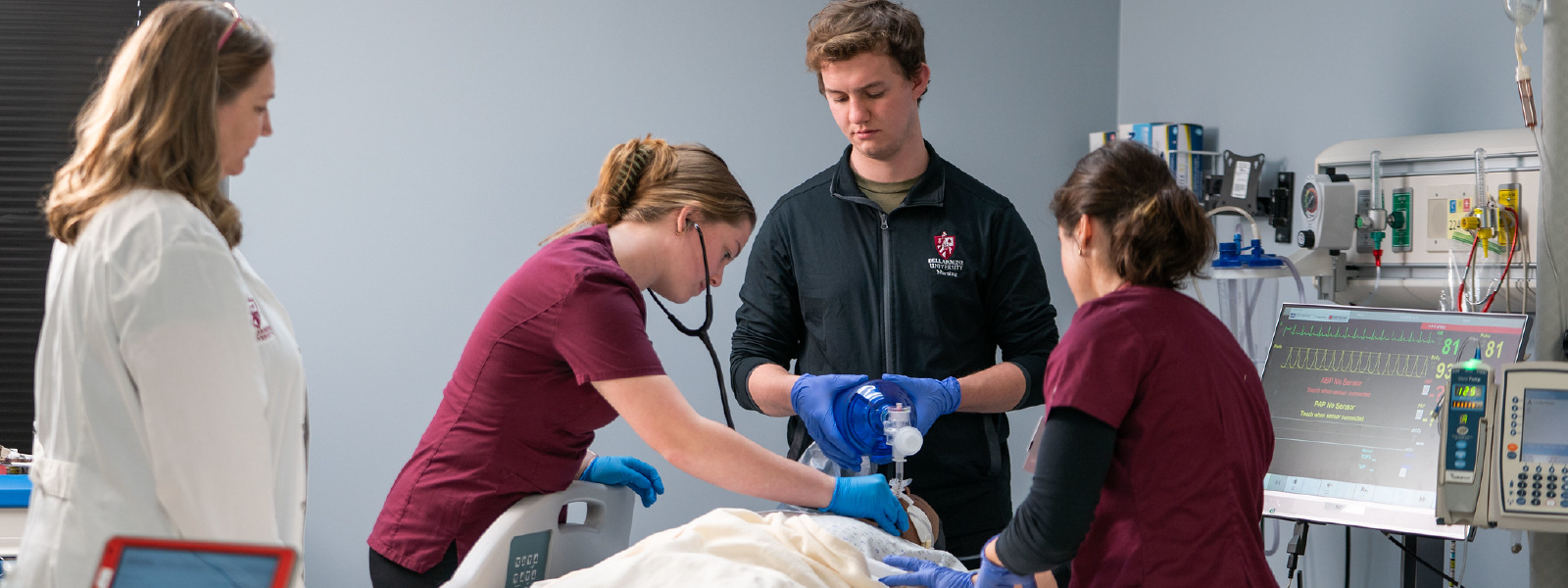 students learning nursing skills in a simulation lab