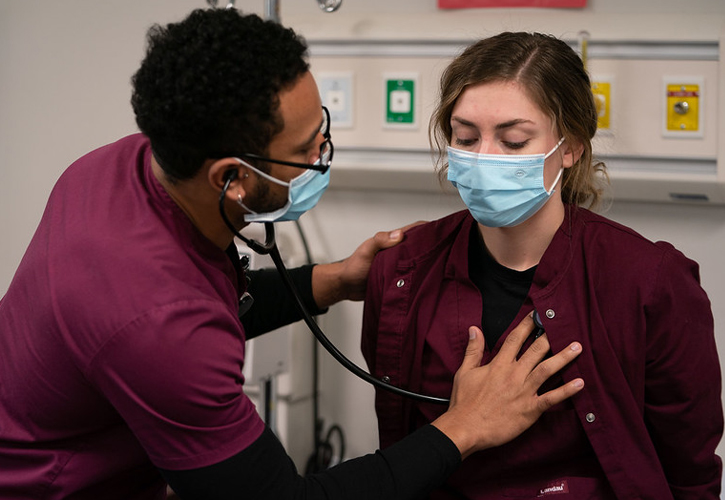 Nursing students taking vitals