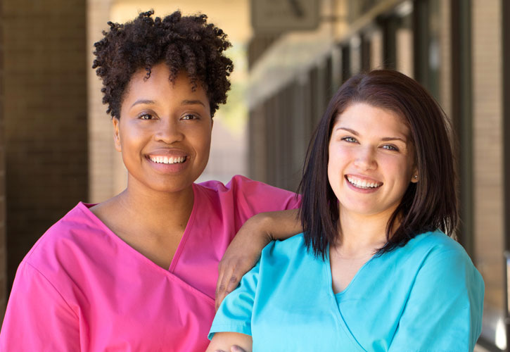 Two nurses on Bellarmine's campus