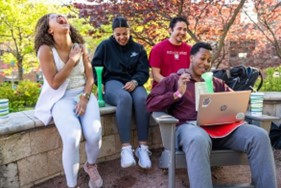 students enjoy an outdoor patio
